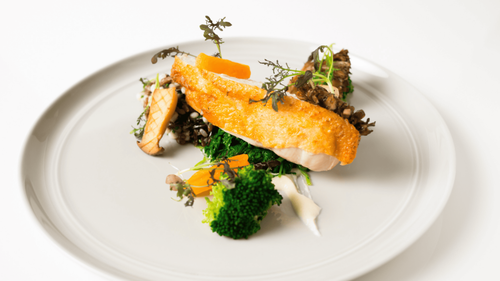 A plate of food ready to be served to customers