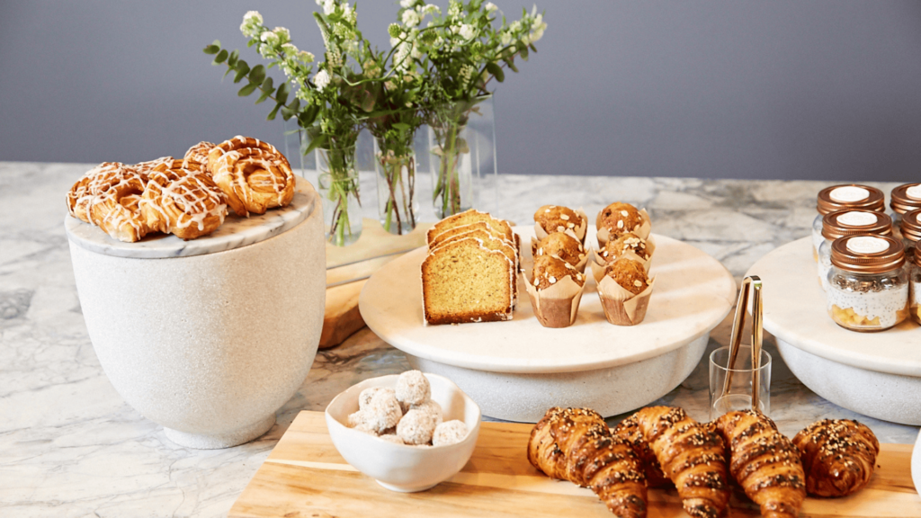 a bunch of different types of bread on a table