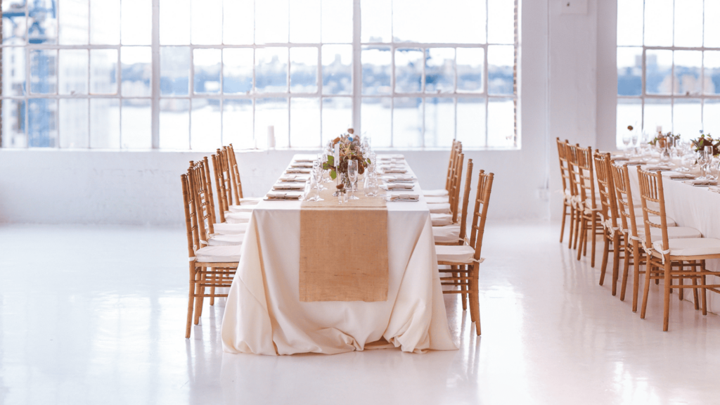 an empty room with tables and chairs for a wedding venue