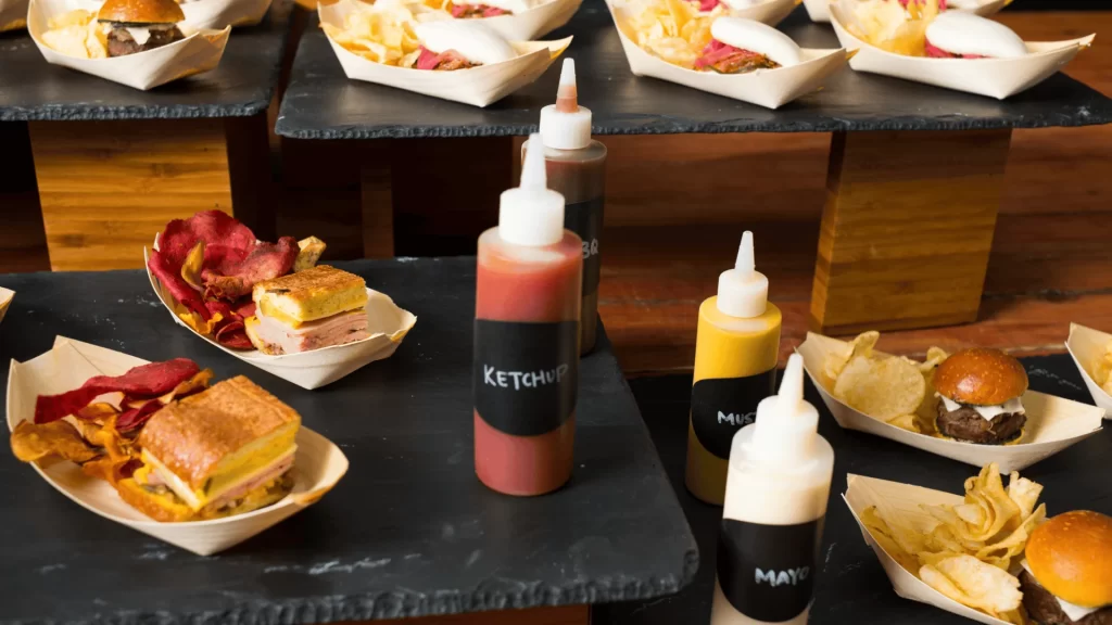 A bunch of dishes with sauces all around them