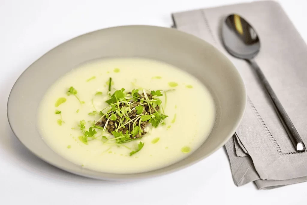 A bowl of gluten free soup ready for a catering event