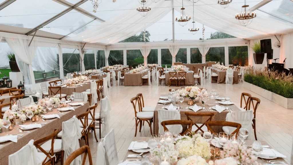 A massive venue with a ton of chairs and tables for guests